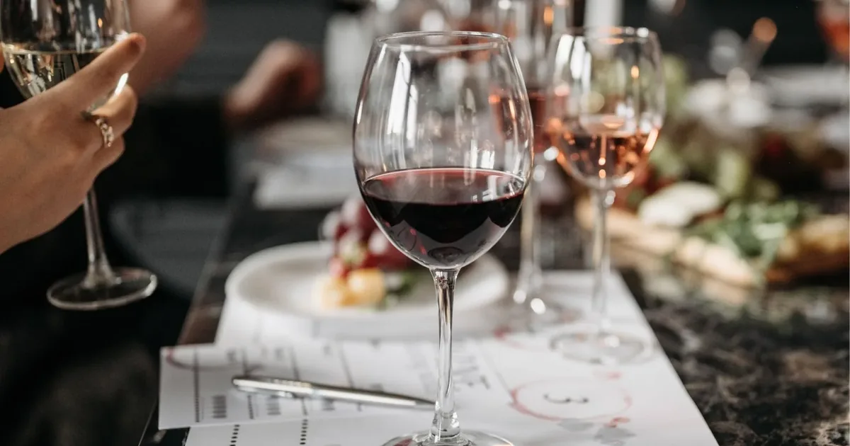 A structured wine tasting flight laid out on a numbered tasting mat, Santorini