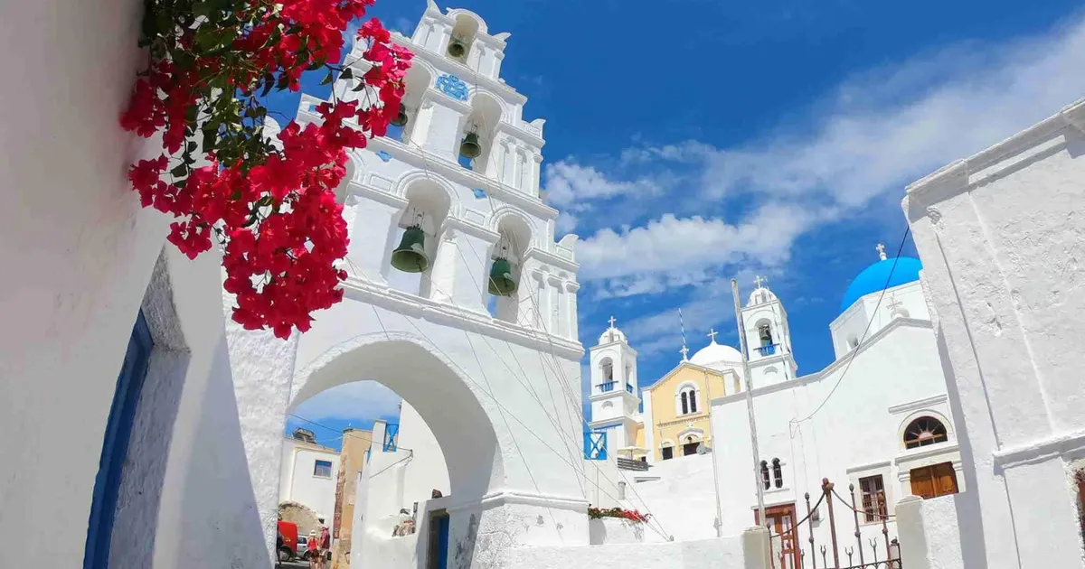 Bell tower and whitewashed lanes in Pyrgos, the village above Santo Wines and Hatzidakis